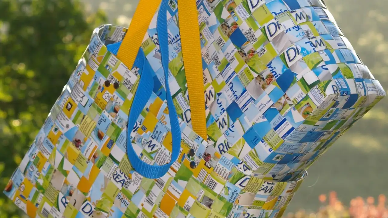 Close up on a plate of mashed potatoes, topped with baked pork chops with cream of mushroom soup, and a side of green beans.