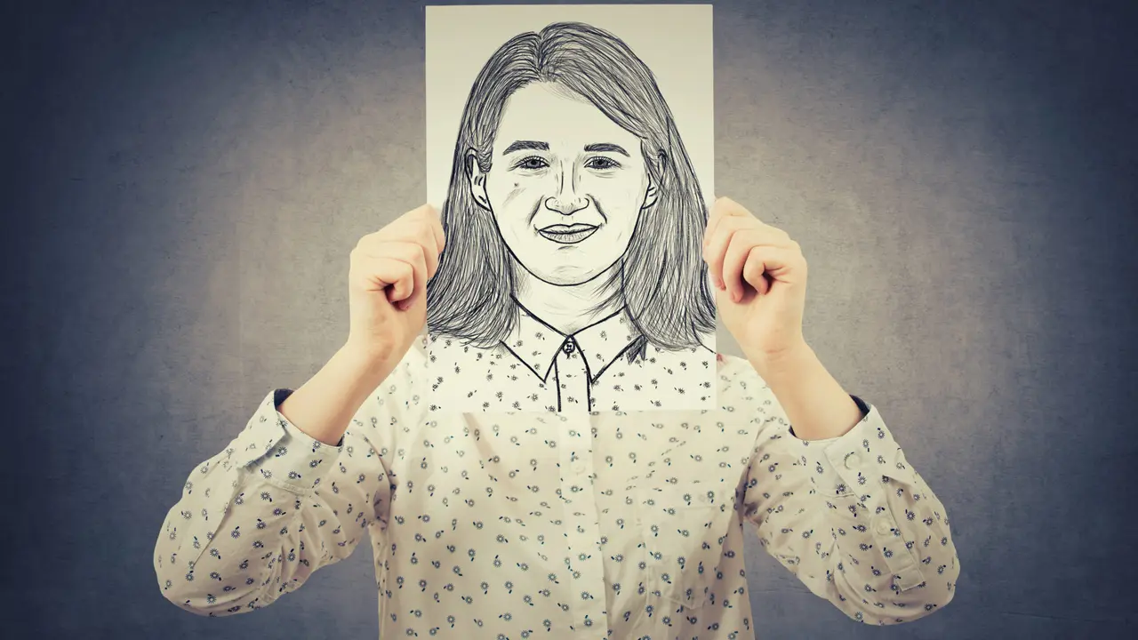 Close up on a plate of mashed potatoes, topped with baked pork chops with cream of mushroom soup, and a side of green beans.