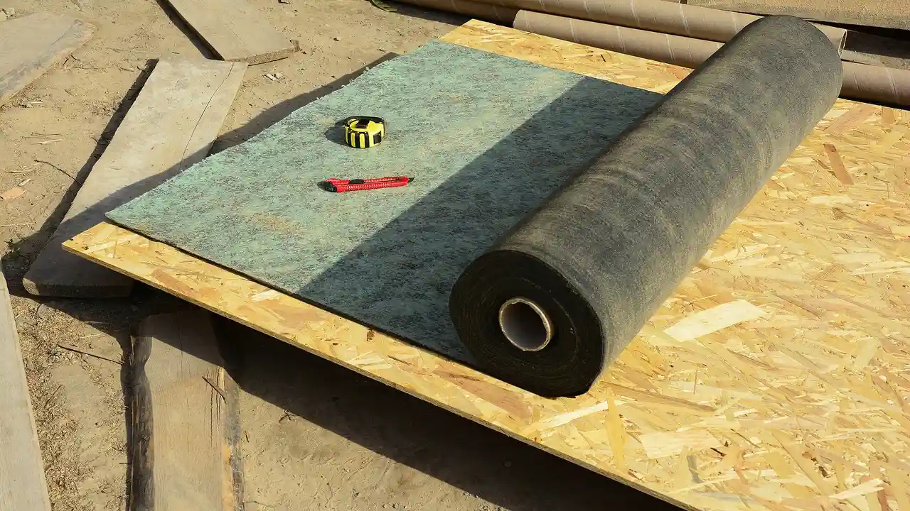 Close up on a plate of mashed potatoes, topped with baked pork chops with cream of mushroom soup, and a side of green beans.